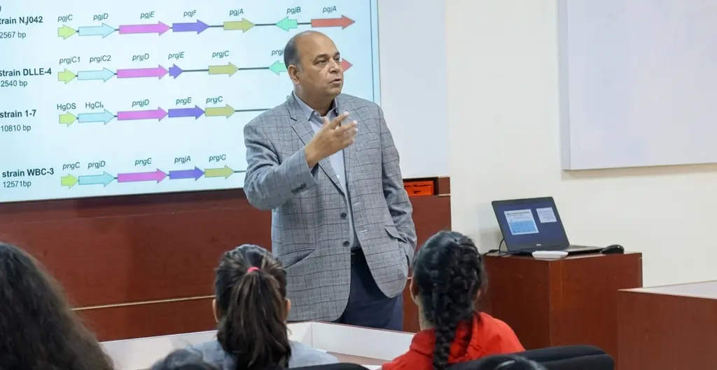 A researcher presents genomic data to students at PRTF
